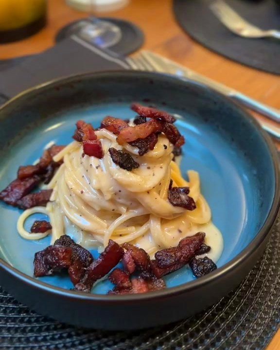 Spaghetti alla carbonara with crispy guanciale, cooked at home by an Italian private chef in Liverpool